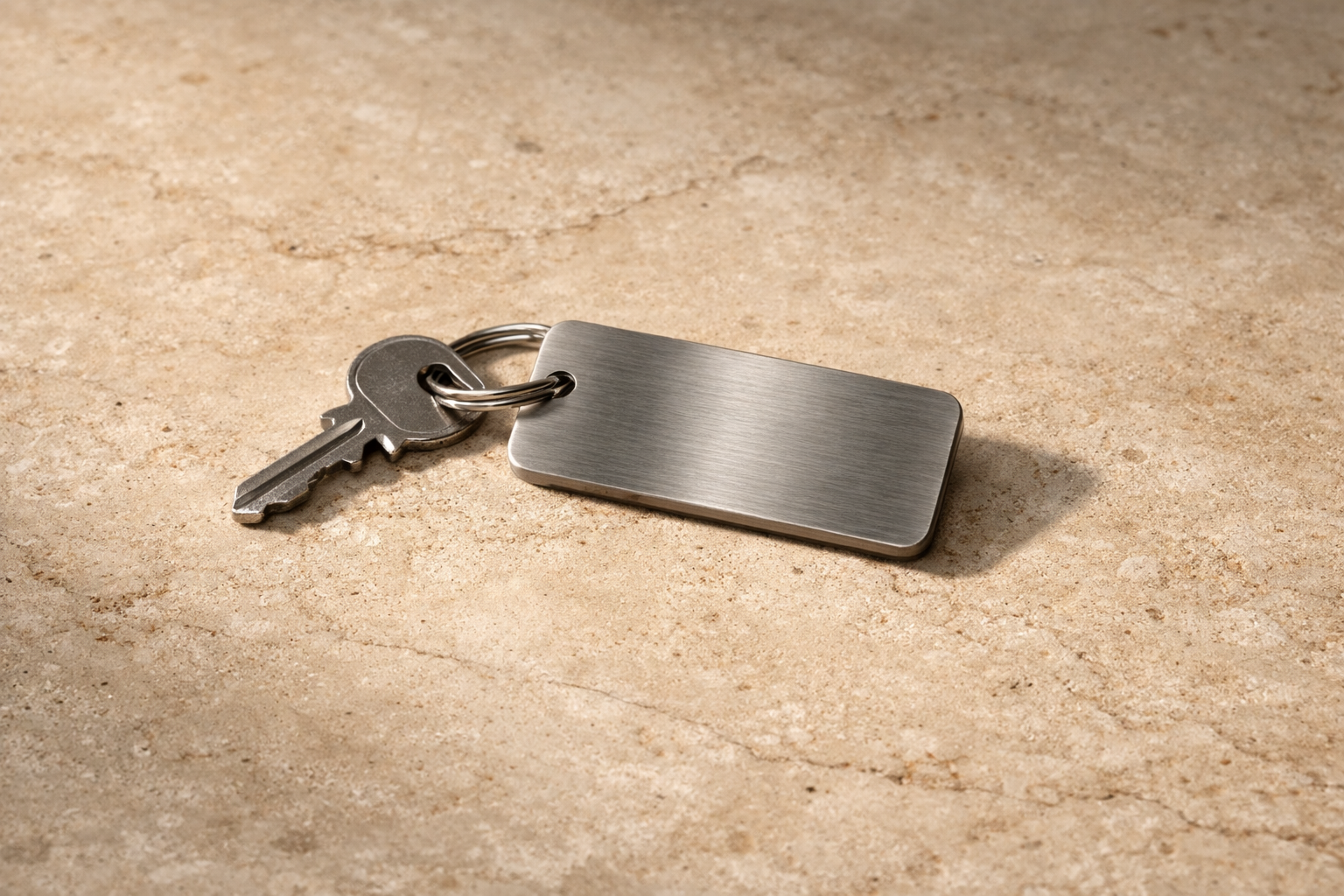 A private Fetson key rendered against a dark field with restrained architectural light.